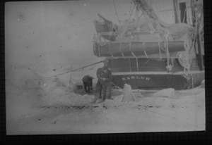 Image: Men working on ice by KARLUK's stern
